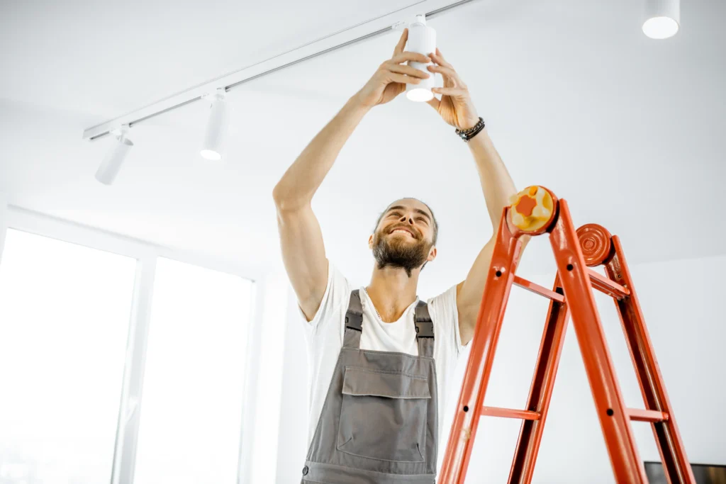 Electrician performing lamp installation in Zurich apartment