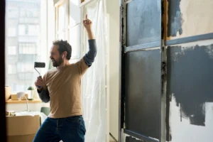 Tenant painting walls in a Swiss rental apartment – cosmetic renovation allowed without landlord approval.