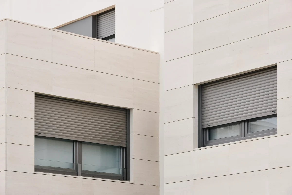 Modern house in Switzerland with retrofitted roller shutters for insulation and privacy